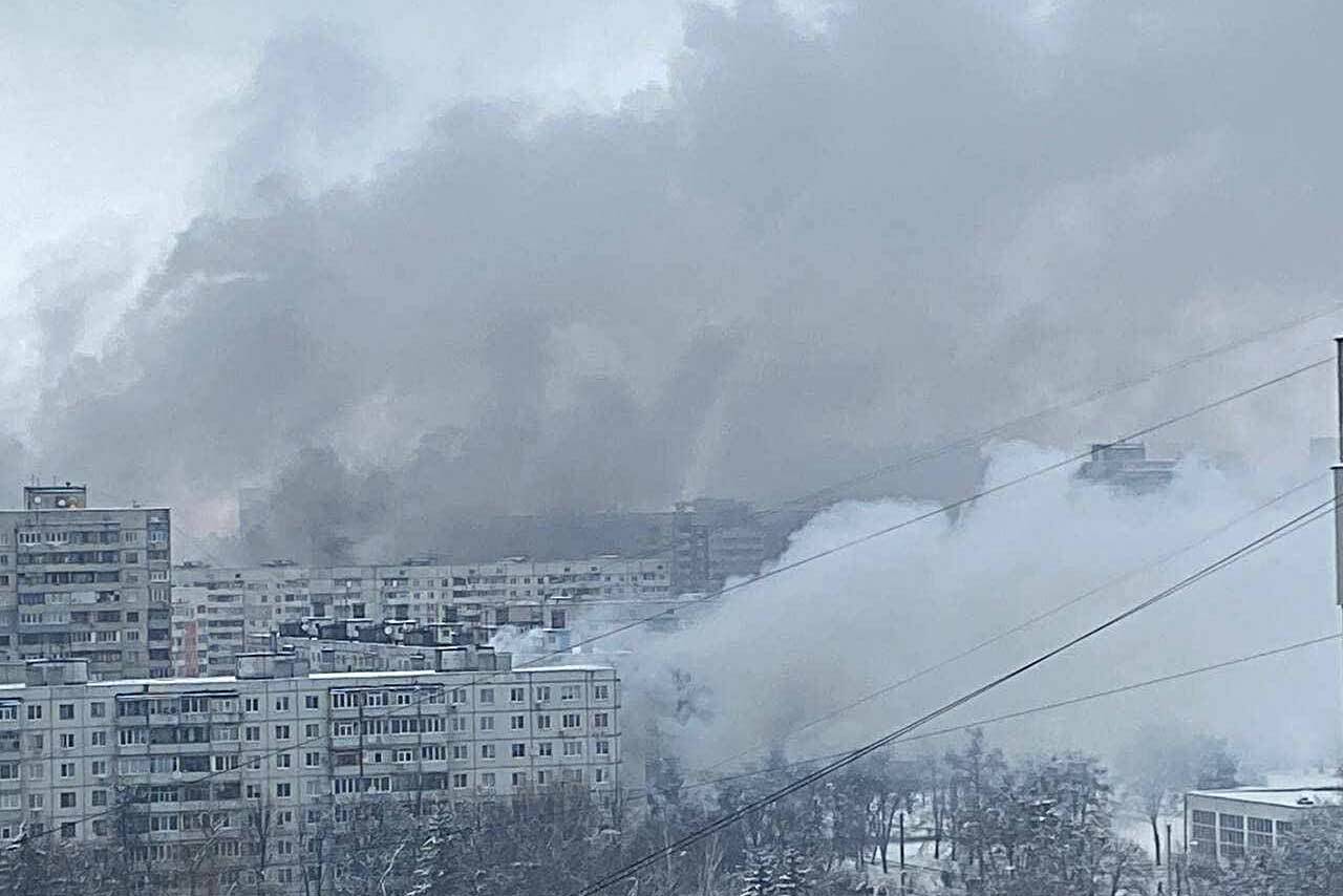 Smoke rises from Kharkiv apartment buildings following a Russian missile bombardment. The image is of an area near the family's apartment building, taken by a friend of Straner's father. Submitted photo.