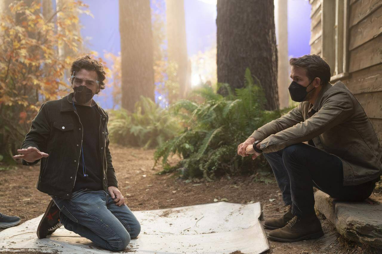 Director Shawn Levy on left, and actor Ryan Reynolds are shown on the set of “The Adam Project” in a handout photo. THE CANADIAN PRESS/HO-Netflix Doane Gregory