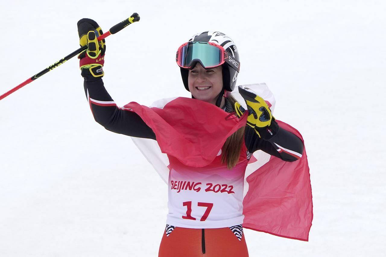 Mollie Jepsen of Canada celebrates after competing in the women’s giant slalom, standing at the 2022 Winter Paralympics, Friday, March 11, 2022, in the Yanqing district of Beijing. (AP Photo/Andy Wong)