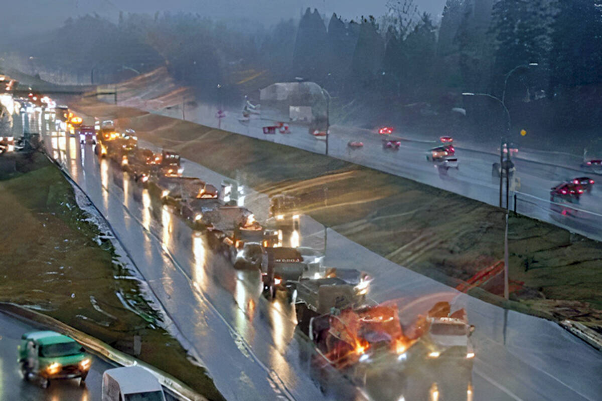 A long lineup of truckers headed west on Highway 1, slowing morning rush hour traffic, on Monday morning, March 14. (DriveBC image)