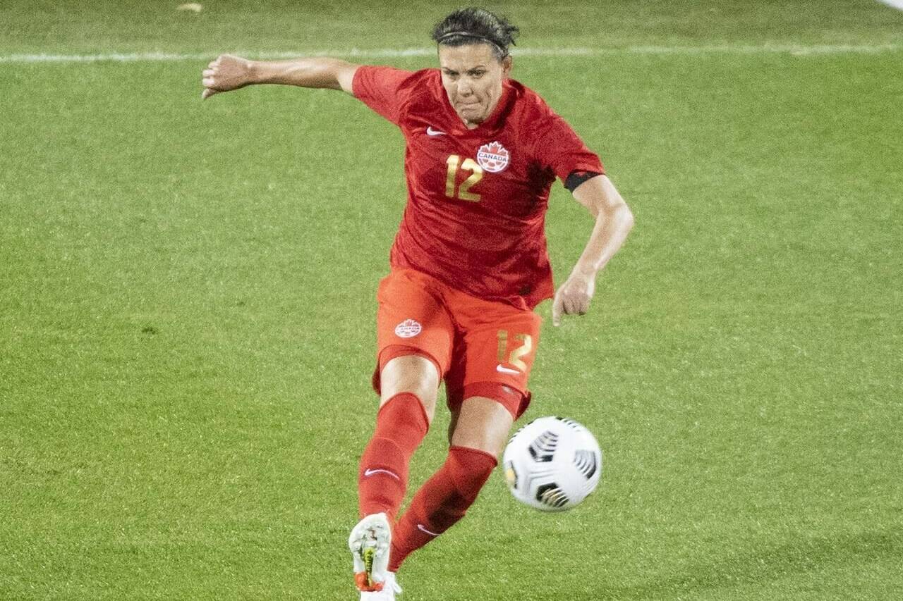 Canada’s Christine Sinclair plays a pass during first half Celebration Tour soccer action against New Zealand, in Montreal, Tuesday, Oct. 26, 2021. Canada Soccer has announced that the country’s gold medal-winning women’s soccer team will face Nigeria in a pair of games in British Columbia next month. THE CANADIAN PRESS/Graham Hughes