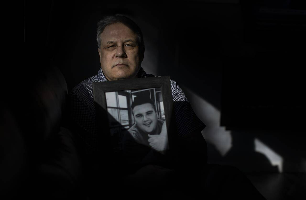 Ray Corbiere holds a picture of his son Joshua Corbiere in Edmonton on Wednesday, March 16, 2022. A father’s hope turned to pain in less than 24 hours after his son entered a residential drug treatment facility and fatally overdosed. THE CANADIAN PRESS/Jason Franson