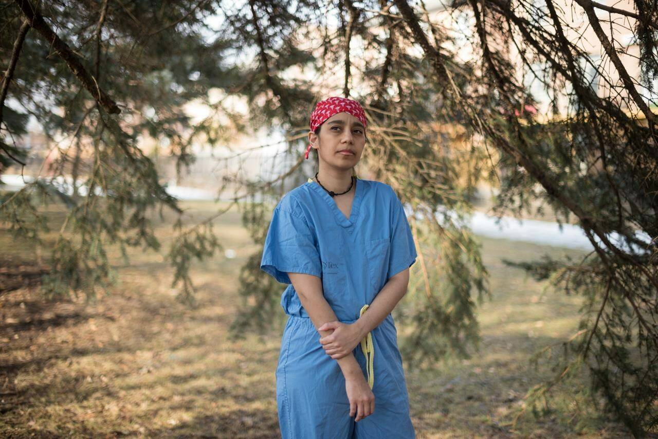 Emergency-room nurse Eram Chhogala poses for a photograph at a park near her home, in Toronto, Thursday, March 17, 2022. THE CANADIAN PRESS/Tijana Martin