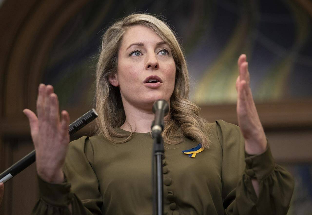 Foreign Affairs Minister Melanie Joly responds to questions in the Foyer of the House of Commons in Ottawa, Tuesday, March 15, 2022. Joly says the Russian invasion of Ukraine has unified western nations like never before and strengthened NATO’s alliance. THE CANADIAN PRESS/Adrian Wyld