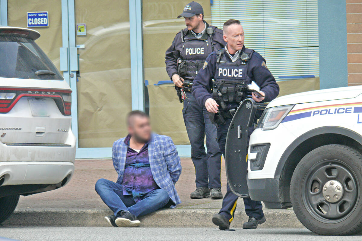 Langley RCMP officers handcuffed one man when they searched an SUV and seized a quality of fake gold in Langley City on Wednesday, March 16, in the 20200 block of Fraser Highway. Because the suspect wasn’t caught in the act of selling, he was released without being charged after agreeing to leave the province. (Dan Ferguson/Langley Advance Times)