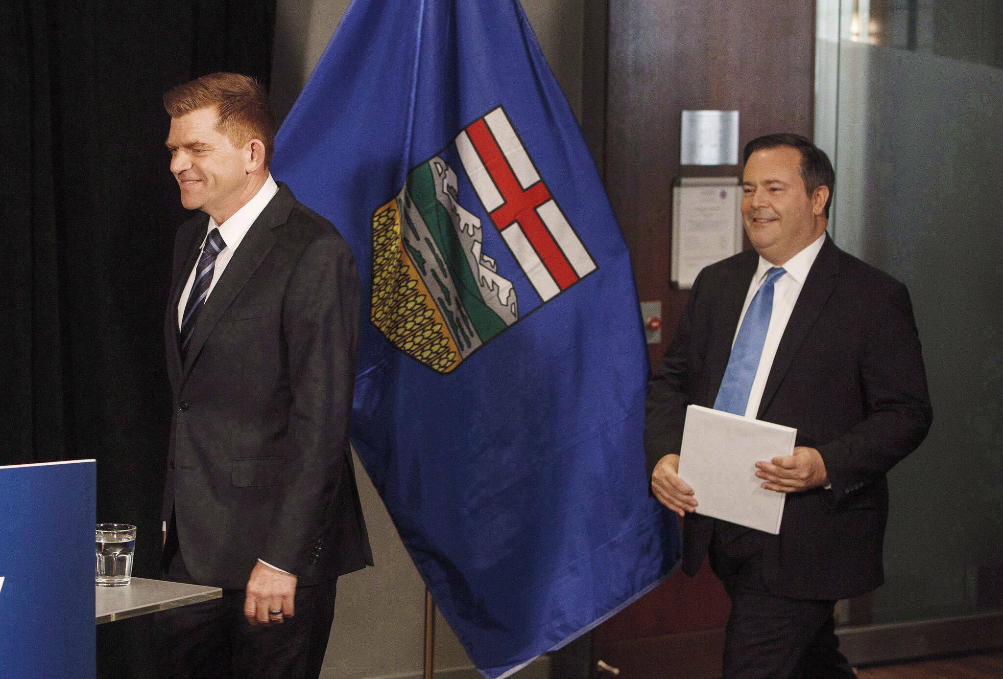 Alberta Wildrose leader Brian Jean, left, and Alberta PC leader Jason Kenney walk in to a press conference to announce a unity deal between the two in Edmonton on Thursday, May 18, 2017. THE CANADIAN PRESS/Jason Franson