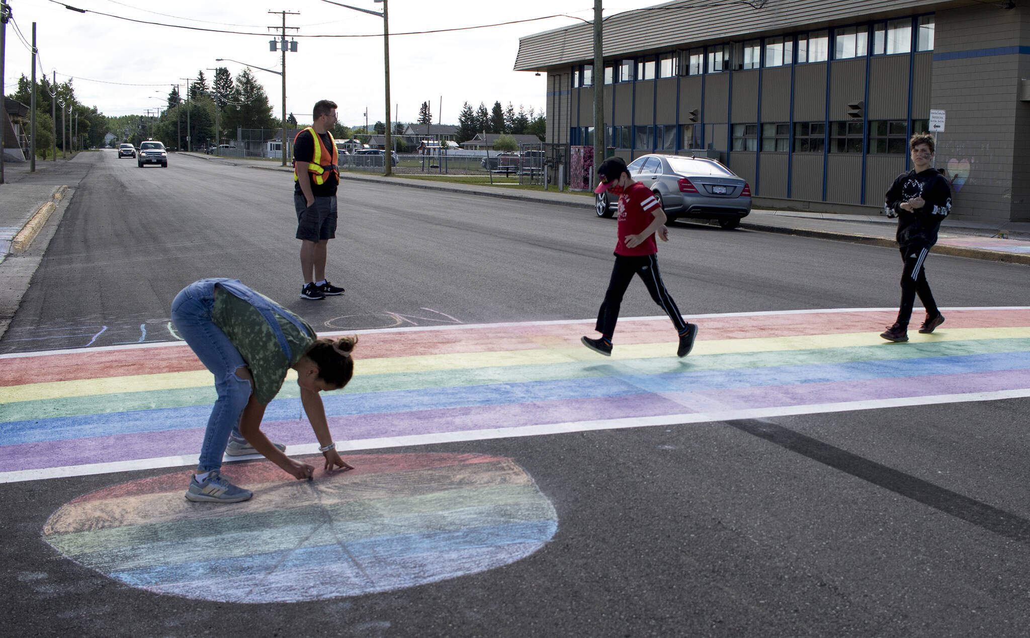 W.L. McLeod Elementary students in Vanderhoof spent a Thursday morning last June remediating the community’s new rainbow crosswalk that was recently damaged by a large burnout. (Photo by Aman Parhar/Omineca Express)