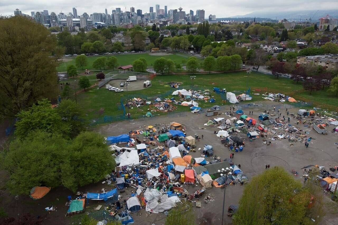 Tents and other structures are seen in an aerial view at a homeless encampment in Vancouver, B.C., on Friday, April 30, 2021. The City of Prince George, B.C., has apologized for the harm it caused to vulnerable people when it removed their structures from a homeless camp.THE CANADIAN PRESS/Darryl Dyck