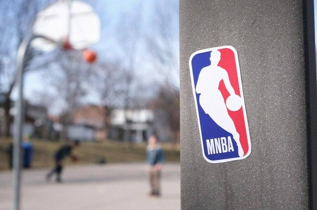 A public basketball court with a sticker of a mocked up NBA logo with “M” in front. The YWCA has added an “M” to men’s leagues logos to start a conversation about gender equity in sports, seen in Toronto, Ont. in this handout photo received March 24, 2022. THE CANADIAN PRESS/HO-YWCA Metro Vancouver **MANDATORY CREDIT**