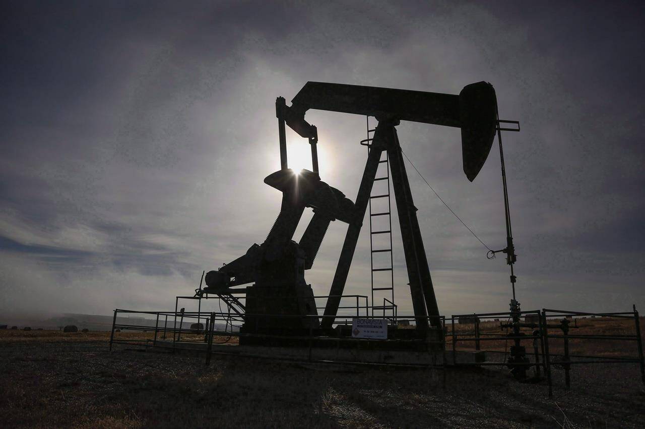 A pumpjack works at a well head on an oil and gas installation near Cremona, Alta., Saturday, Oct. 29, 2016. THE CANADIAN PRESS/Jeff McIntosh