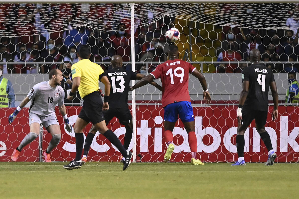 Canada’s goalkeeper Milan Borjan, centre, eyes the ball after Costa Rica’s Celso Borges scored a goal during a World Cup qualifying soccer match in San Jose, Costa Rica, Thursday, March 24, 2022. (AP Photo/Carlos Gonzalez)