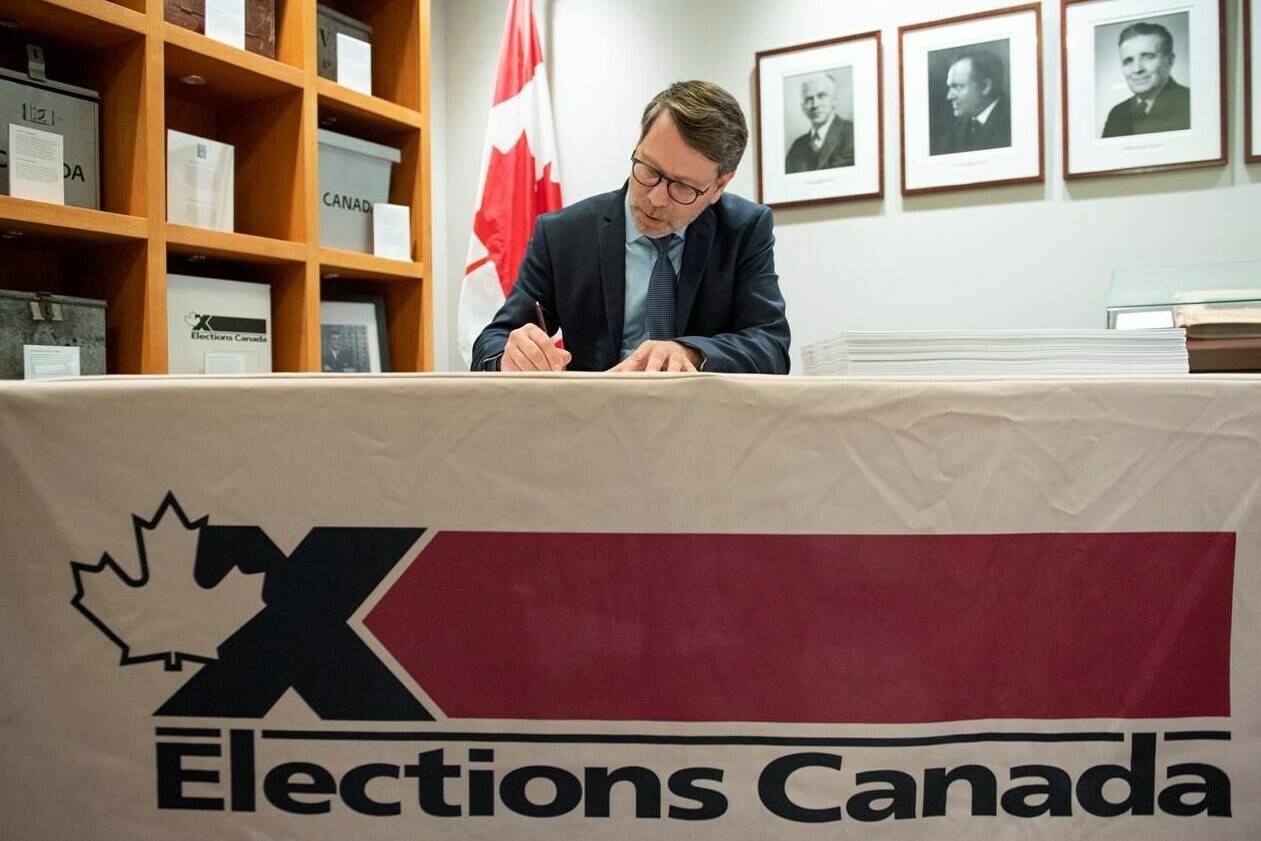 Chief Electoral Officer Stephane Perrault signs the writs of the 43rd general election during a photo opportunity in Gatineau, Que., Friday, Sept. 20, 2019. THE CANADIAN PRESS/Justin Tang