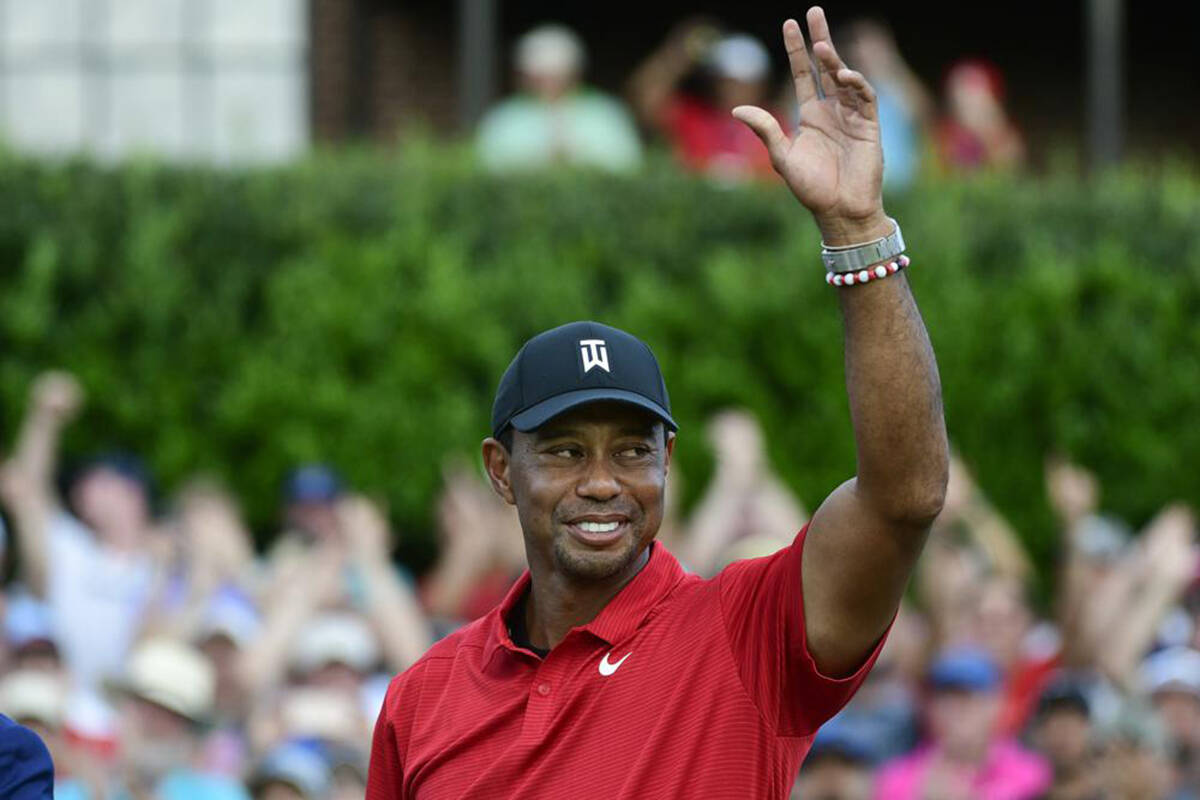 Tiger Woods celebrates on the 18th green after wining the Tour Championship golf tournament Sunday, Sept. 23, 2018, in Atlanta. (AP Photo/John Amis, File)