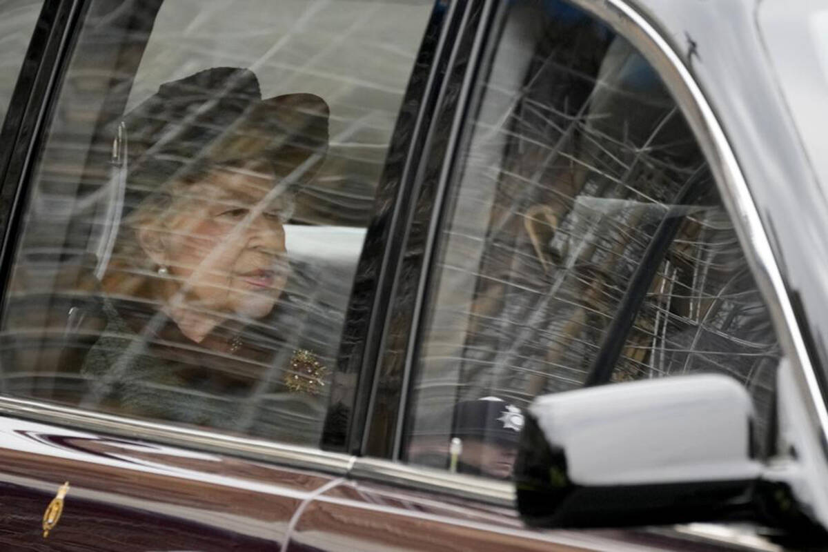 Britain’s Queen Elizabeth II is driven in to attend a Service of Thanksgiving for the life of Prince Philip, Duke of Edinburgh at Westminster Abbey in London, Tuesday, March 29, 2022. (AP Photo/Frank Augstein)