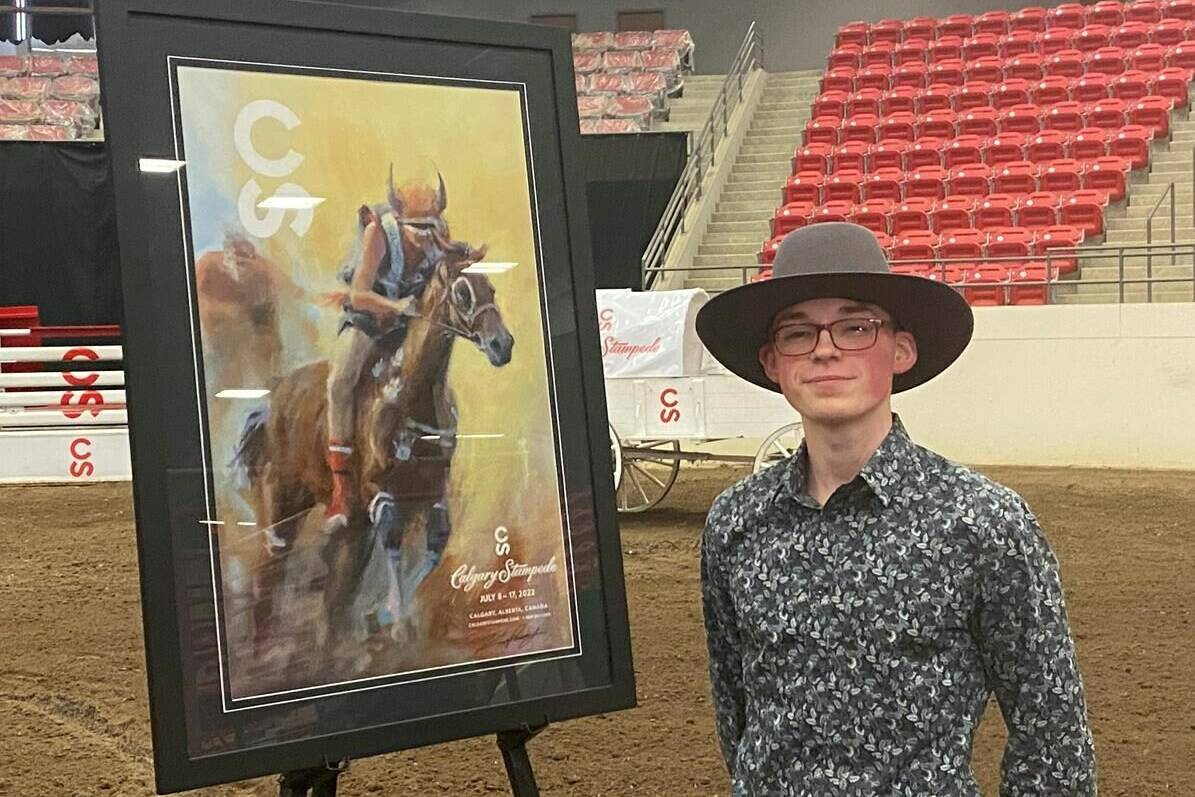 Artist Kane Pendry of Edmonton shows off his work on the 2022 Calgary Stampede poster in Calgary on Wednesday, March 30, 2022. THE CANADIAN PRESS/Bill Graveland