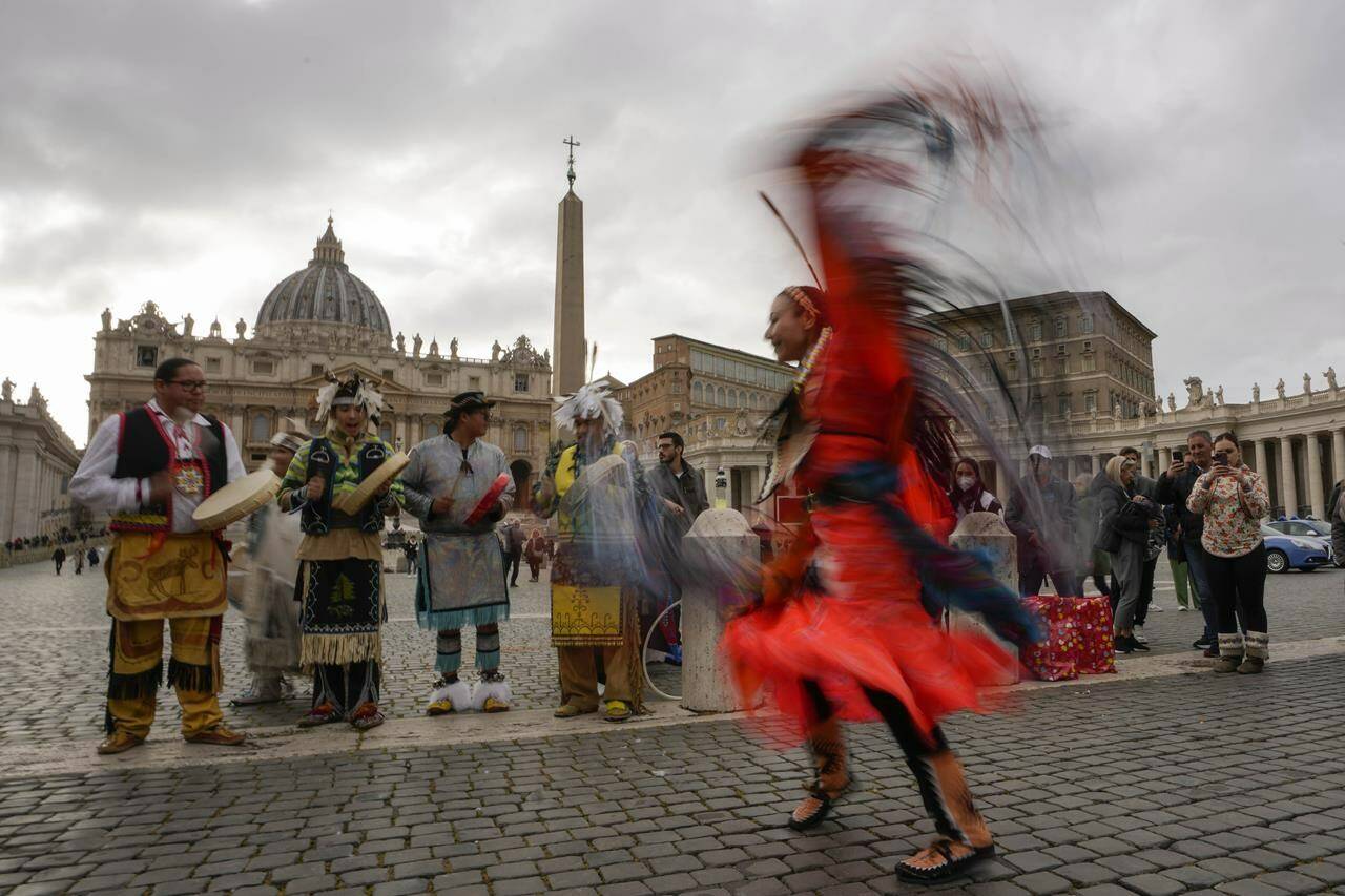 Members of the Assembly of First Nations perform in St. Peter’s Square at the Vatican, Thursday, March 31, 2022. First Nations, Inuit and Métis delegates are set to have a final meeting with Pope Francis in the Vatican today. THE CANADIAN PRESS/AP-Alessandra Tarantino