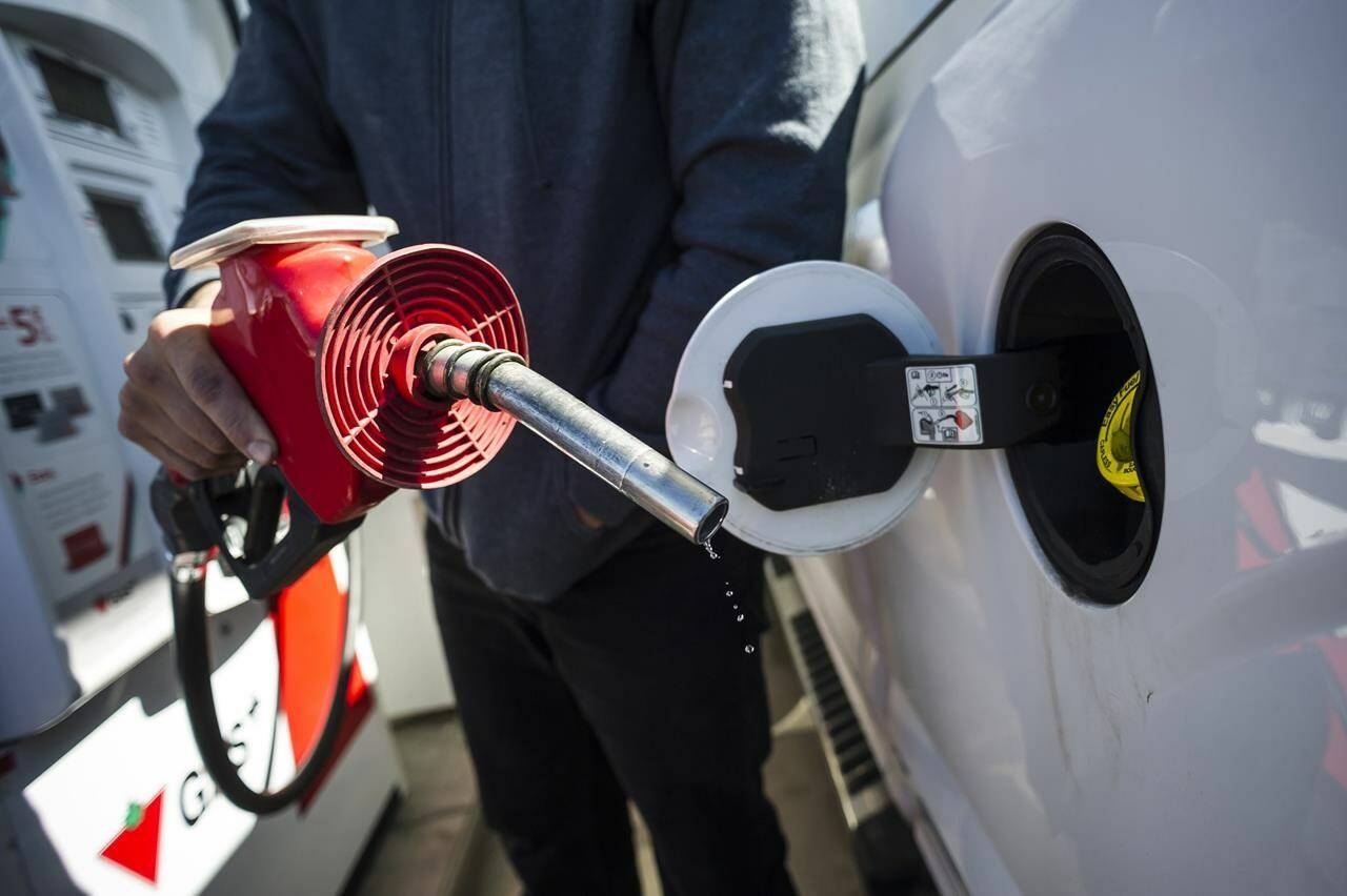 A man fills up his truck with gas in Toronto, on April 1, 2019. The national price on pollution will go up another $10 per tonne of greenhouse gas emissions as scheduled today in most provinces. THE CANADIAN PRESS/Christopher Katsarov