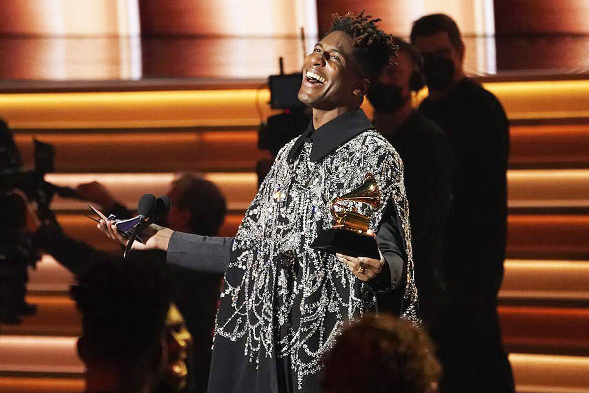 Jon Batiste accepts the award for album of the year for “We Are” at the 64th Annual Grammy Awards on Sunday, April 3, 2022, in Las Vegas. (AP Photo/Chris Pizzello)