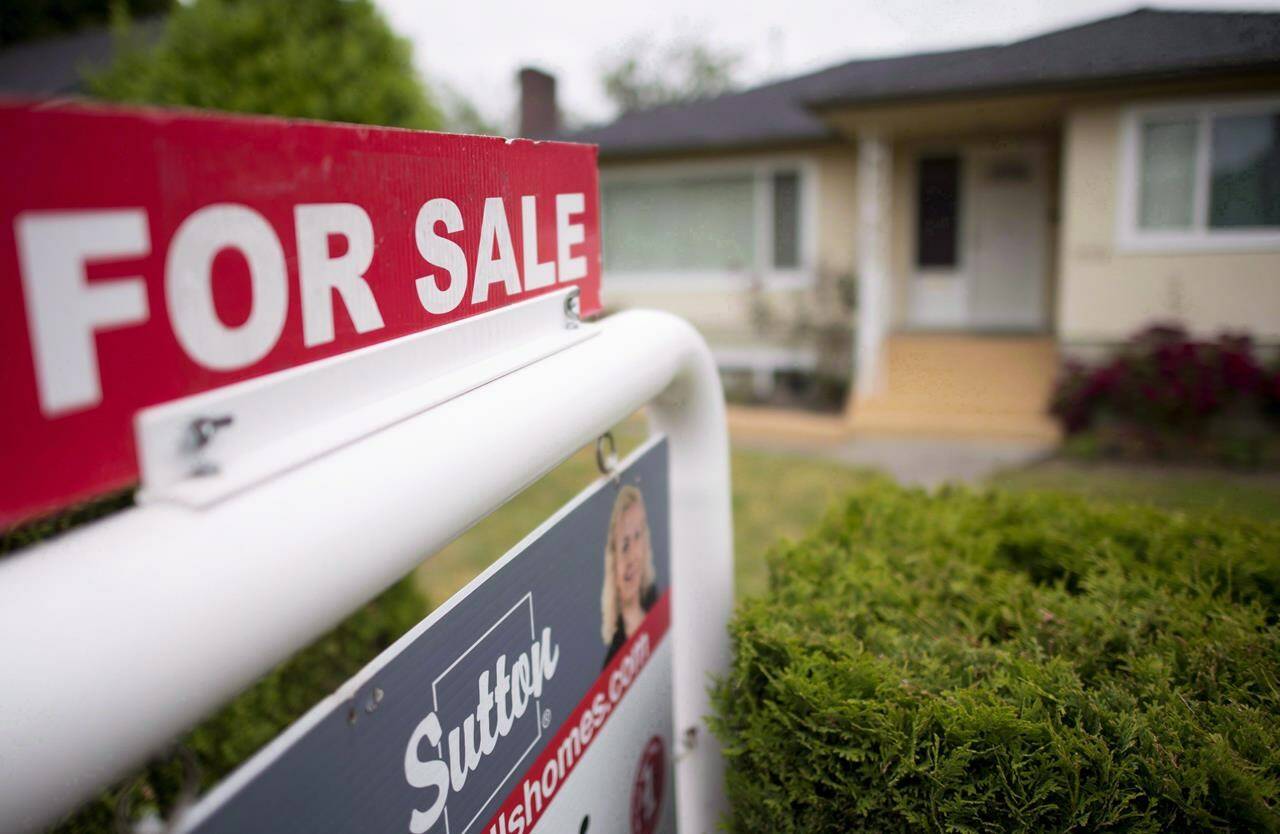 A real estate sign is pictured in Vancouver, B.C., Tuesday, June, 12, 2018.The Real Estate Board of Greater Vancouver says home sales picked up between February and March but are still down from a year ago. THE CANADIAN PRESS Jonathan Hayward
