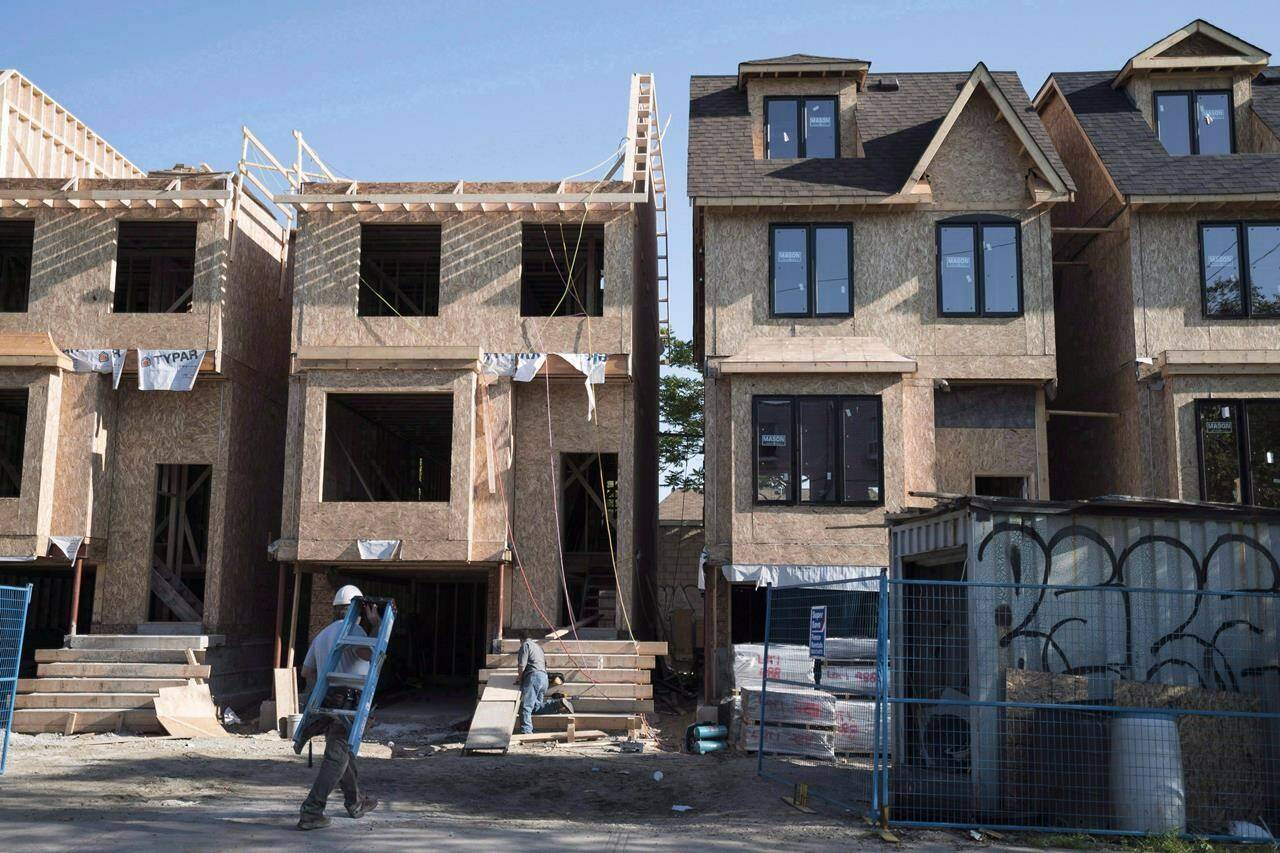 Houses under construction in Toronto, Friday, June 26, 2015. A local governance think tank says municipalities across Canada face housing development constraints that can be eased through more co-operation between all levels of government.THE CANADIAN PRESS/Graeme Roy