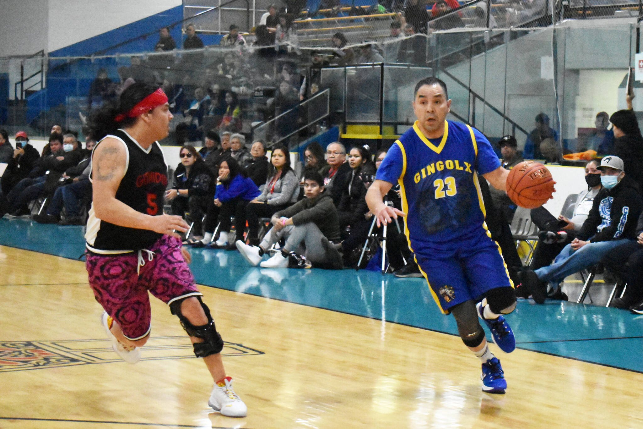 Kincolith’s Vern Stephens, right, drives the baseline against Richard Wolff of New Aiyansh during Masters Division action at the All Native Basketball Tournament in Prince Rupert on Day 3 (April 5). (Thom Barker photo)