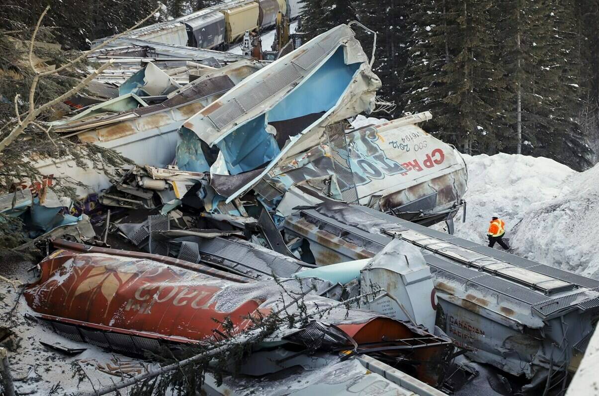 Families of two of three workers killed in a train derailment near Field, B.C., in 2019 have filed lawsuits accusing Canadian Pacific of gross negligence. The derailment sent 99 grain cars and two locomotives off the tracks. THE CANADIAN PRESS/Jeff McIntosh