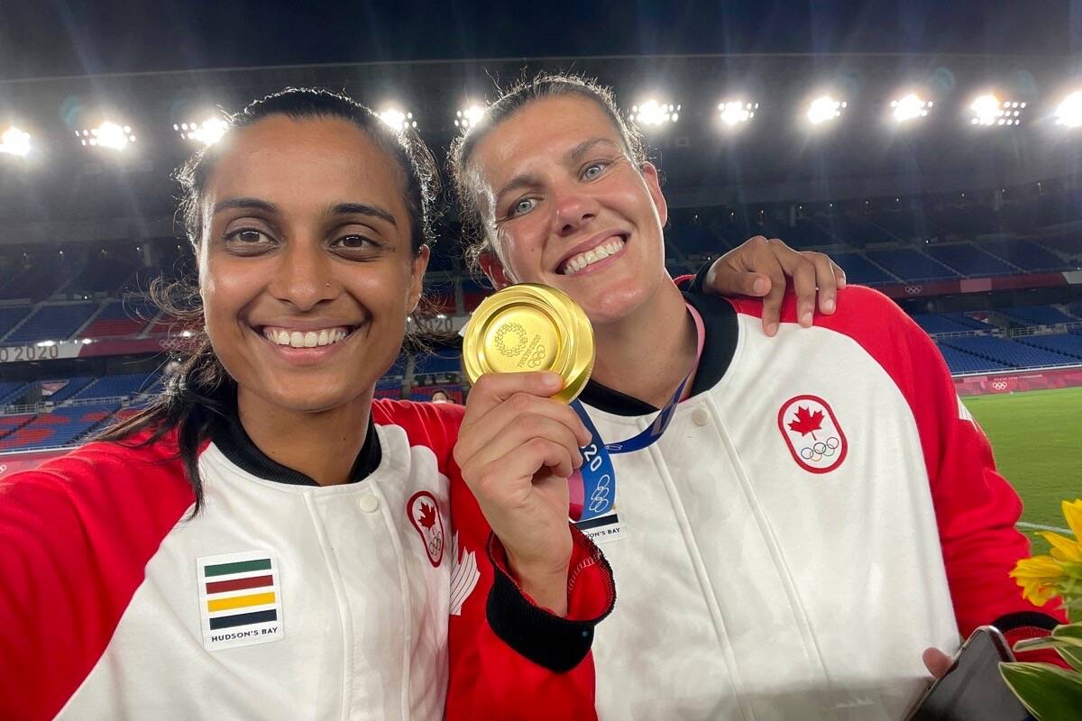 North Delta’s Jasmine Mander (left) poses for a selfie with Canadian women’s soccer team captain Christine Sinclair after the team won Olympic gold at International Stadium in Yokohama, Japan on Aug. 6, 2021. (Jasmine Mander/submitted photo)