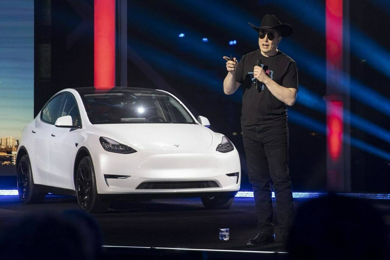 Tesla CEO Elon Musk speaks at the “Cyber Rodeo” grand opening celebration for the new $1.1 billion Tesla Giga Texas manufacturing facility in Austin, Texas, on Thursday April 7, 2022. Musk says the company will build an electric vehicle dedicated for use as a robotaxi. Musk didn’t give details of the robotaxi other than to say it will “look quite futuristic.” (Jay Janner /Austin American-Statesman via AP)