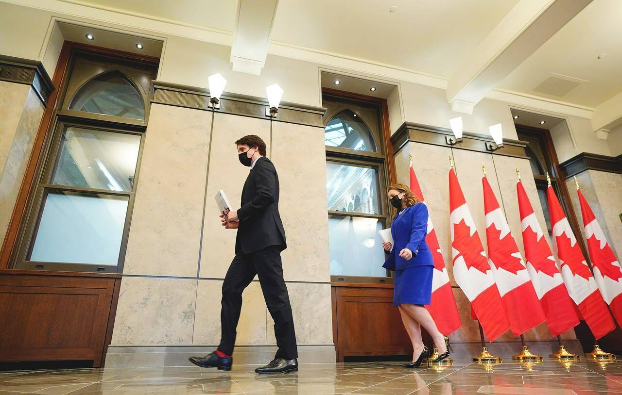 Finance Minister and Deputy Prime Minister Chrystia Freeland and Prime Minister Justin Trudeau leave a press conference before the release of the federal budget, on Parliament Hill, in Ottawa, Thursday, April 7, 2022. Trudeau says Canada is donating another $220 million to the COVAX global vaccine sharing alliance. THE CANADIAN PRESS/Sean Kilpatrick
