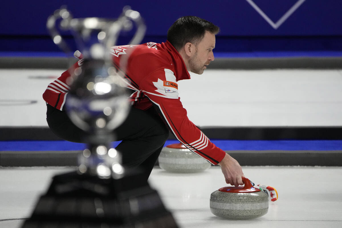 Canada Skip Brad Gushue prepares to deliver a stone against Sweden during a gold medal game at the World Men’s Curling Championships, Sunday, April 10, 2022, in Las Vegas. (AP Photo/John Locher)