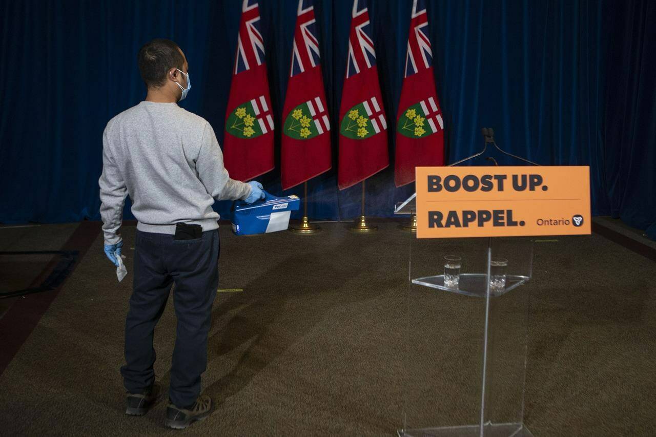 The room which hosted the news conference held by Ontario Premier Doug Ford at the Queen’s Park Legislature in Toronto is disinfected on Monday, Jan. 3, 2022. THE CANADIAN PRESS/Chris Young