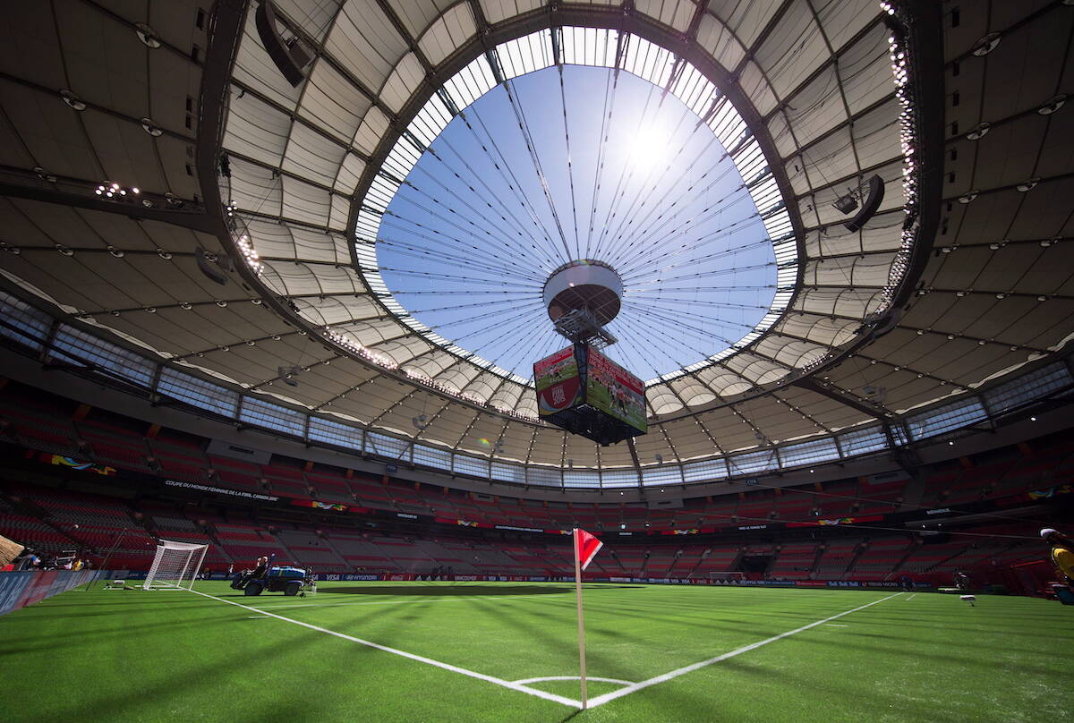 Water is sprayed on the artificial turf before Switzerland and Ecuador play a FIFA Women’s World Cup soccer match at B.C. Place stadium in Vancouver, B.C., on Friday June 12, 2015. THE CANADIAN PRESS/Darryl Dyck