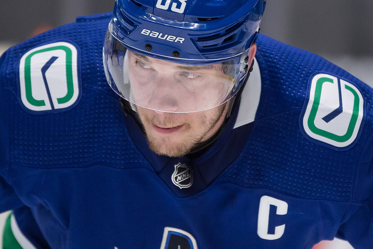 Vancouver Canucks’ Bo Horvat prepares to take a faceoff during the first period of an NHL hockey game against the Toronto Maple Leafs, in Vancouver on Sunday, April 18, 2021. THE CANADIAN PRESS/Darryl Dyck