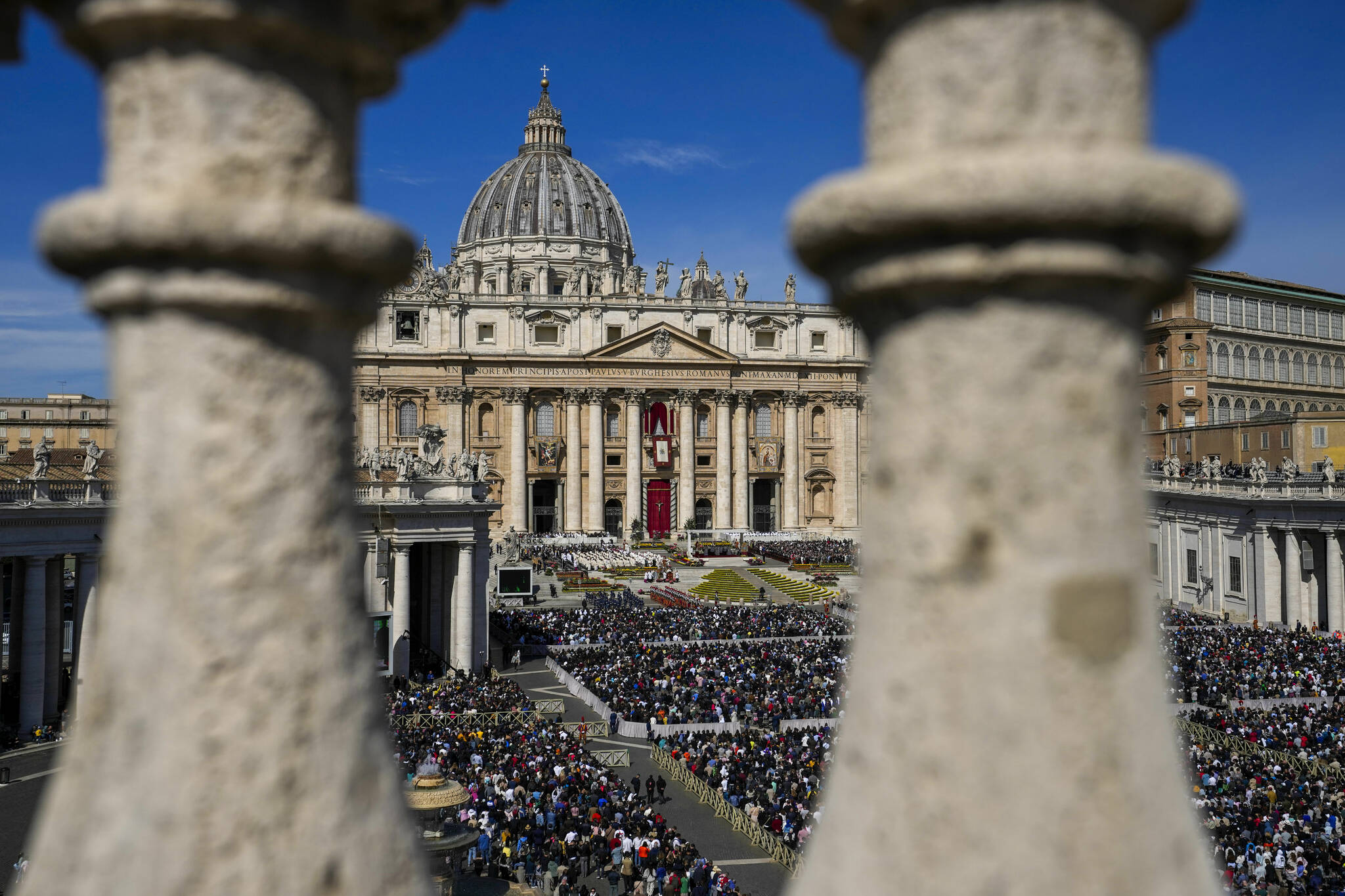 Faithful gather to attend the Catholic Easter Sunday mass led by Pope Francis in St. Peter’s Square at the Vatican, Sunday, April 17, 2022. For many Christians, this weekend marks the first time in three years they will gather in person to celebrate Easter Sunday. (AP Photo/Alessandra Tarantino)