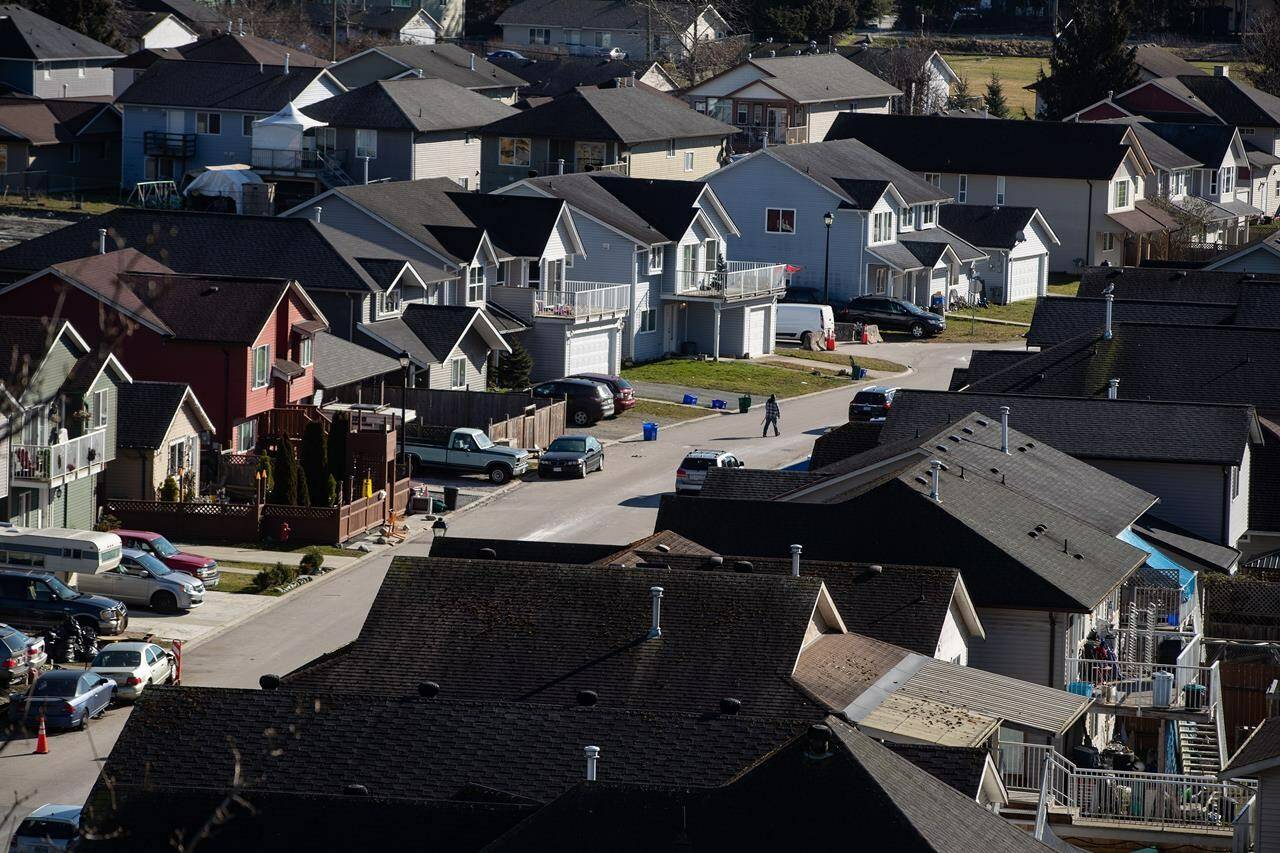 Houses are seen on Squamish Nation land in North Vancouver, on Tuesday, February 22, 2022. The Canadian Real Estate Association says home sales in Canada fell in March, while prices were up 11.2 per cent compared with a year earlier. THE CANADIAN PRESS/Darryl Dyck