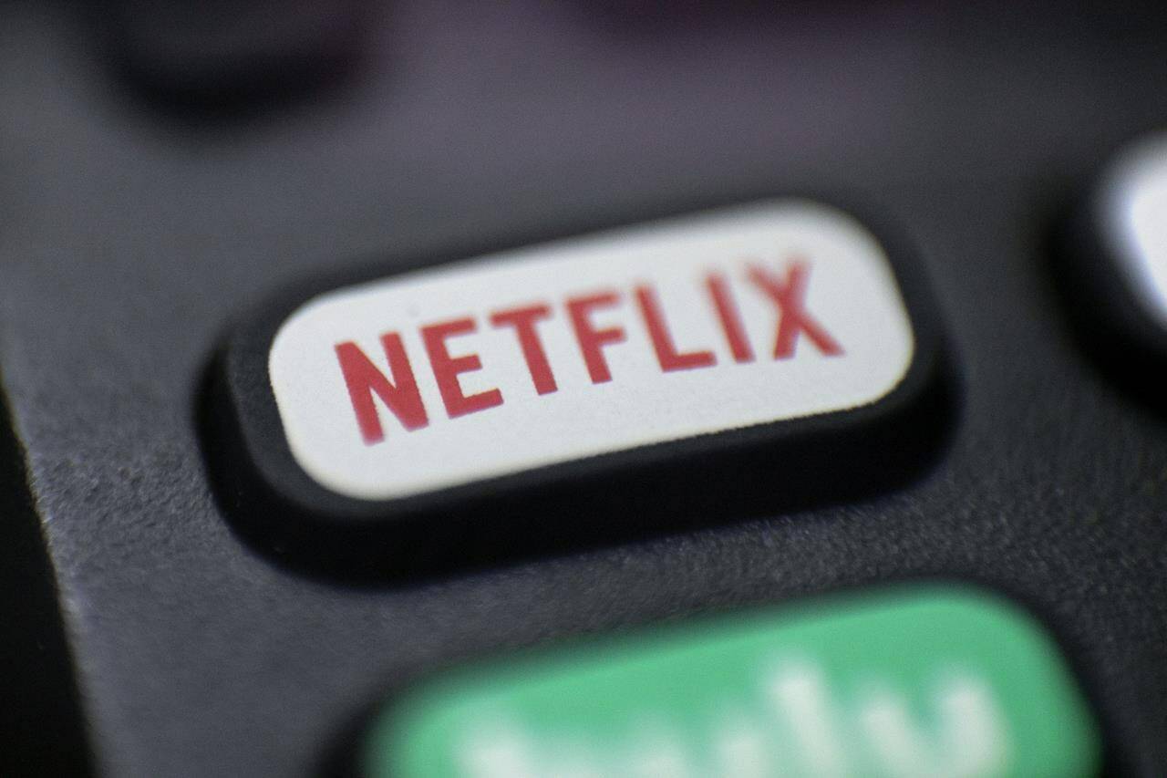 This Aug. 13, 2020, photo shows a logo for Netflix on a remote control in Portland, Ore. Netflix’s video streaming service suffered the first loss in worldwide subscribers in its history, leading to a massive sell-off of its shares. The company’s customer base fell by 200,000 subscribers during the January-March period, according to a quarterly report released Tuesday, April 19, 2022; its stock dropped by 23% in after-market trading. (AP Photo/Jenny Kane, file)