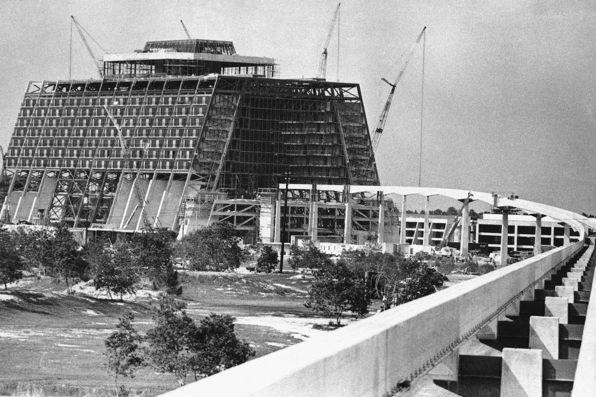 Monorail tracks and concrete pilings lead into contemporary hotel under construction at Walt Disney World July 7, 1971 Orlando, Florida. The idea was presented to Florida lawmakers in a movie house outside Orlando, Florida 55 years ago: Let Disney form its own government and in exchange it would create a futuristic city of tomorrow. (AP Photo/SDS)