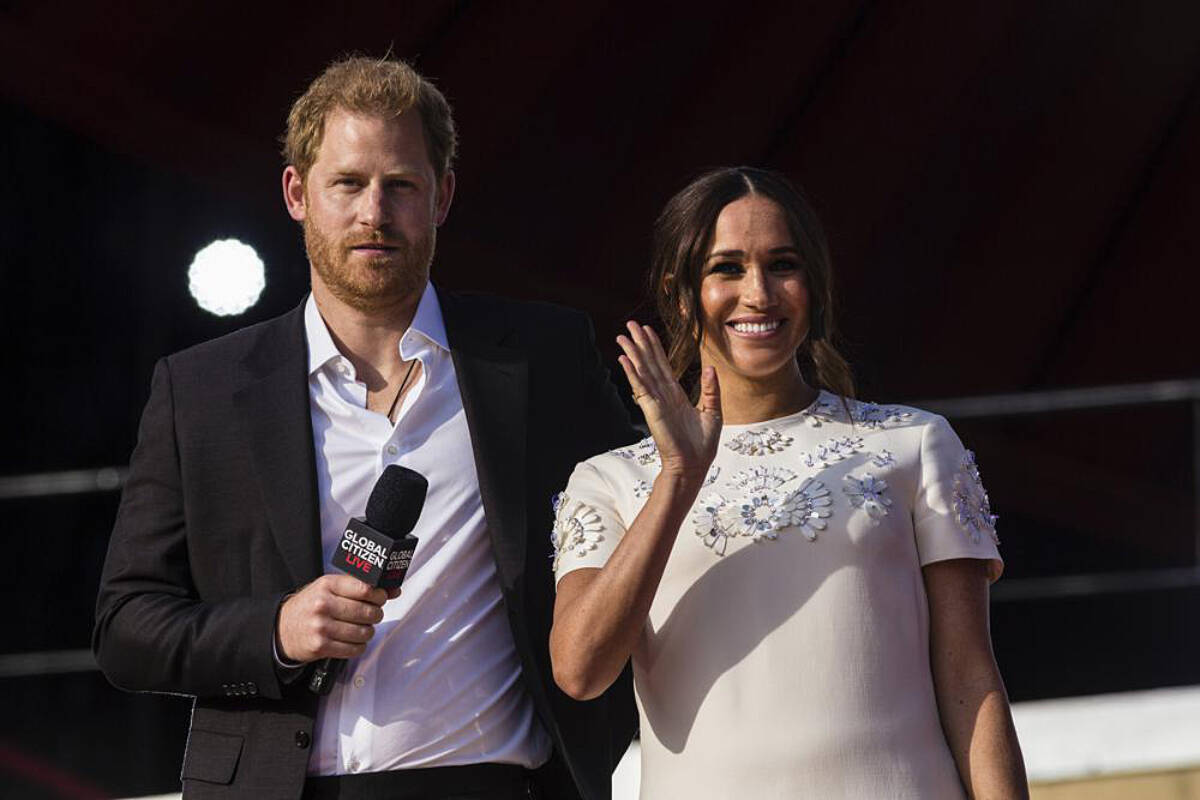 Prince Harry and his wife Meghan speak during the Global Citizen festival, on Sept. 25, 2021 in New York. Prince Harry and his wife Meghan have visited Queen Elizabeth II at Windsor Castle on their first joint visit to the U.K. since they gave up formal royal roles and moved to the U.S. more than two years ago. The couple’s office says they visited the 95-year-old queen, Harry’s grandmother, Thursday, April 14, 2022 on their way to the Netherlands to attend the Invictus Games (AP Photo/Stefan Jeremiah, File)