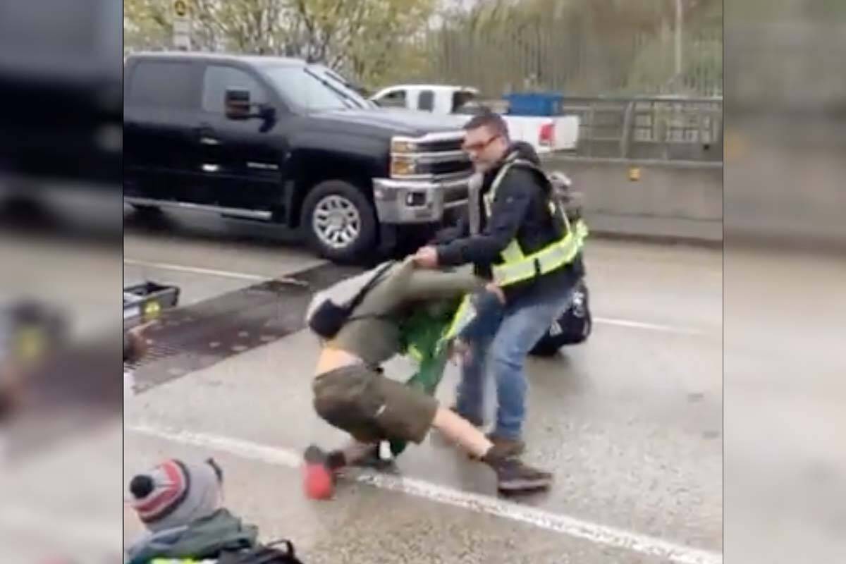 A video captured on the Ironworkers Memorial Bridge in Metro Vancouver Thursday (April 21) morning, shows angry drivers dragging old growth logging protestors, who were blocking their commute, out of the way. (Save Old Growth/Twitter)