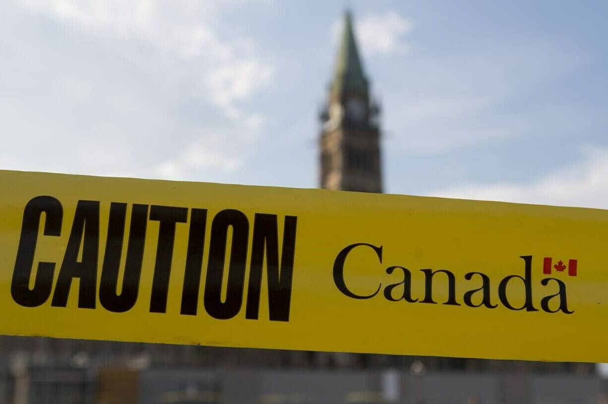 Caution tape is seen around the front lawn of Parliament Hill in Ottawa, Tuesday July 7, 2020. New measures to ensure Canada doesn’t export sensitive technology to foreign adversaries are among the changes being eyed by Ottawa to bolster the country’s economic security.THE CANADIAN PRESS/Adrian Wyld