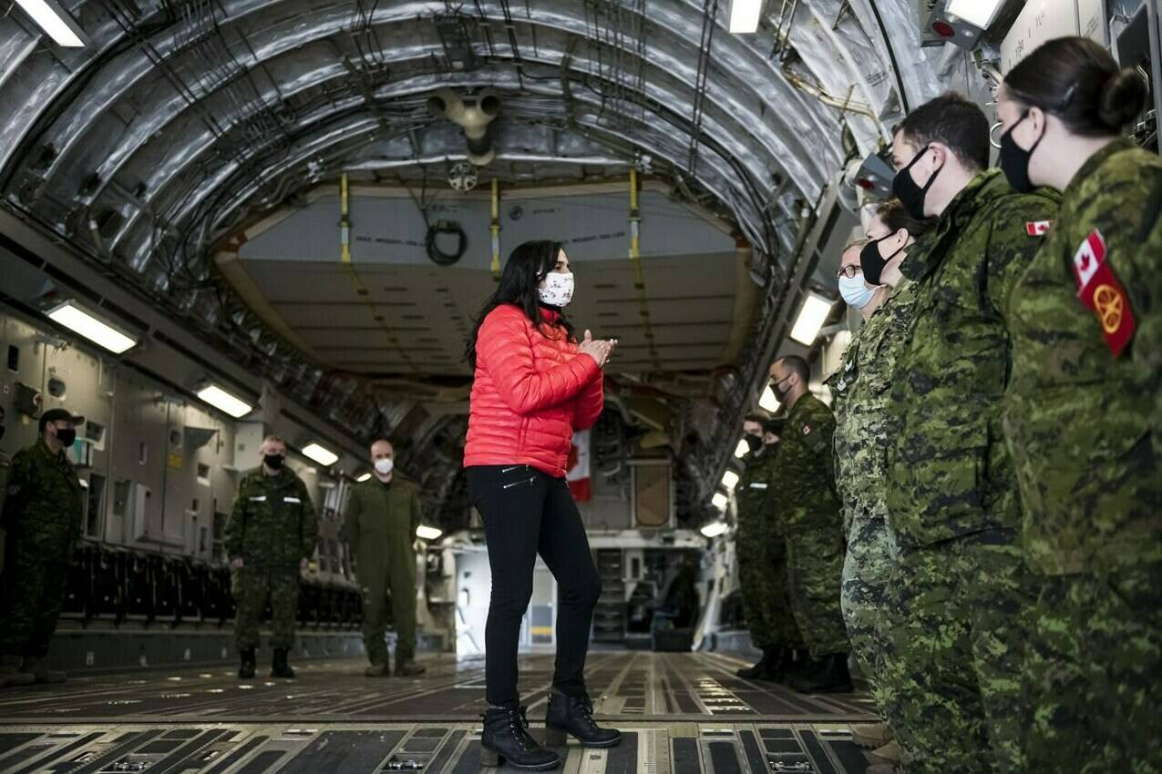 Defence Minister Anita Anand speaks to military personnel after getting a tour of the CC 177 Globemaster aircraft at Canadian Forces Base Trenton, in Trenton, Ont., Thursday, April 14, 2022. THE CANADIAN PRESS/Christopher Katsarov