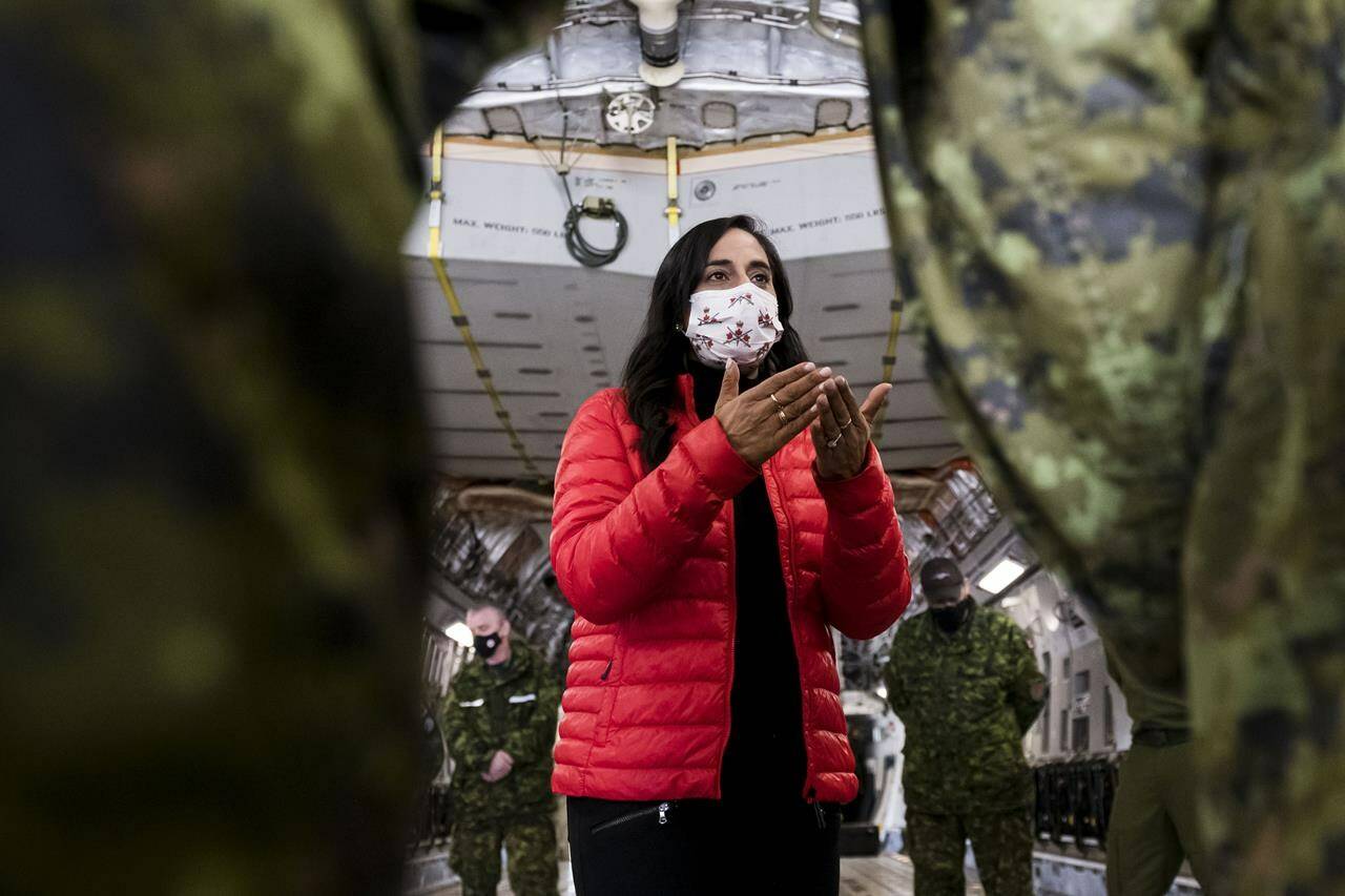 Defence Minister Anita Anand speaks to military personnel after getting a tour of the CC 177 Globemaster aircraft at Canadian Forces Base Trenton, in Trenton, Ont., Thursday, April 14, 2022. THE CANADIAN PRESS/Christopher Katsarov