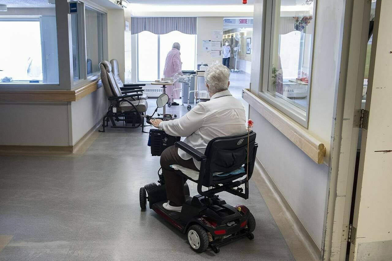 Residents are shown at Idola Saint-Jean long-term care home in Laval, Que., Friday, February 25, 2022. The latest census release on aging marks another milestone on the slow march to what experts warn will be a crisis in care for Canada’s elders. CANADIAN PRESS/Graham Hughes