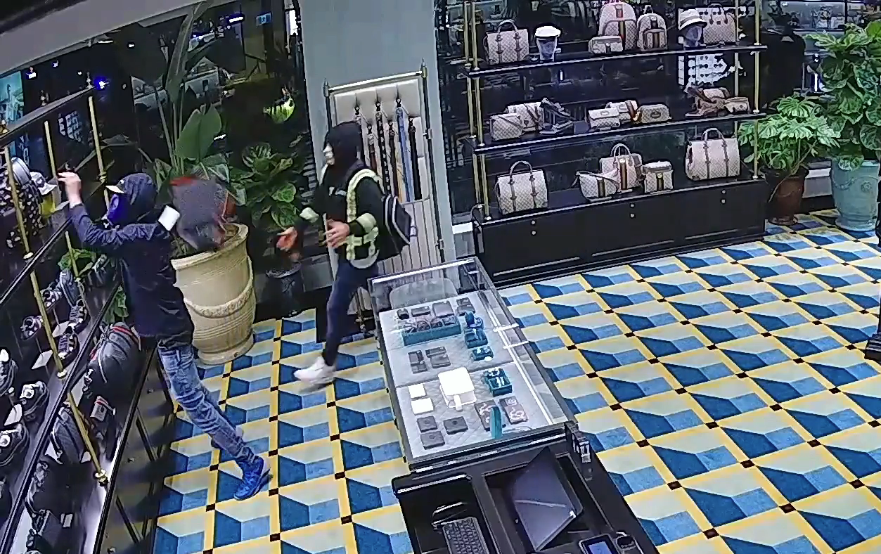 Two men were caught on surveillance video robbing a Vancouver Gucci store in December 2021. (Courtesy VPD)