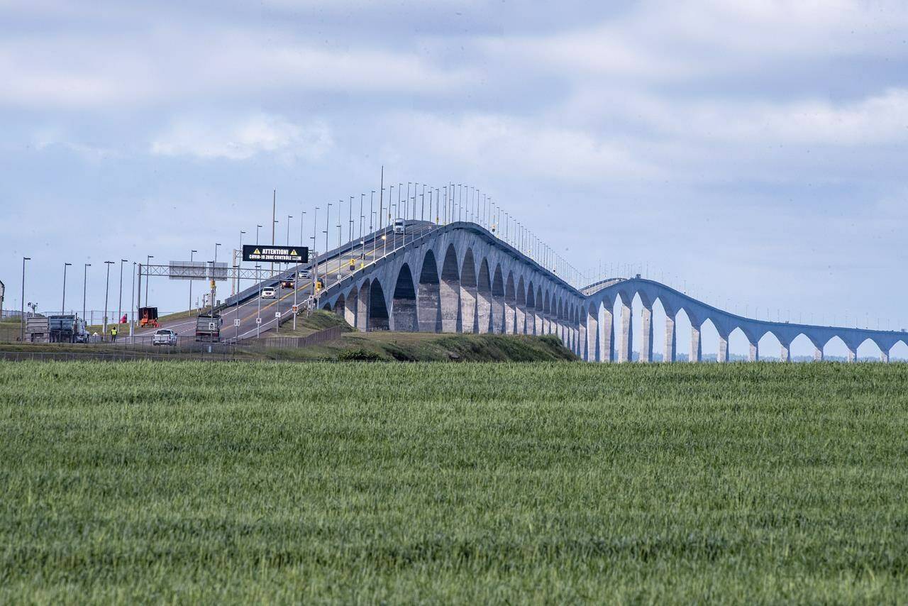Motorists line up to cross the Confederation Bridge on Friday July 3, 2020. Members of the Prince Edward Island legislature voted unanimously to ask the federal government to change the name of the Confederation Bridge to Epekwitk Crossing. THE CANADIAN PRESS/Brian McInnis