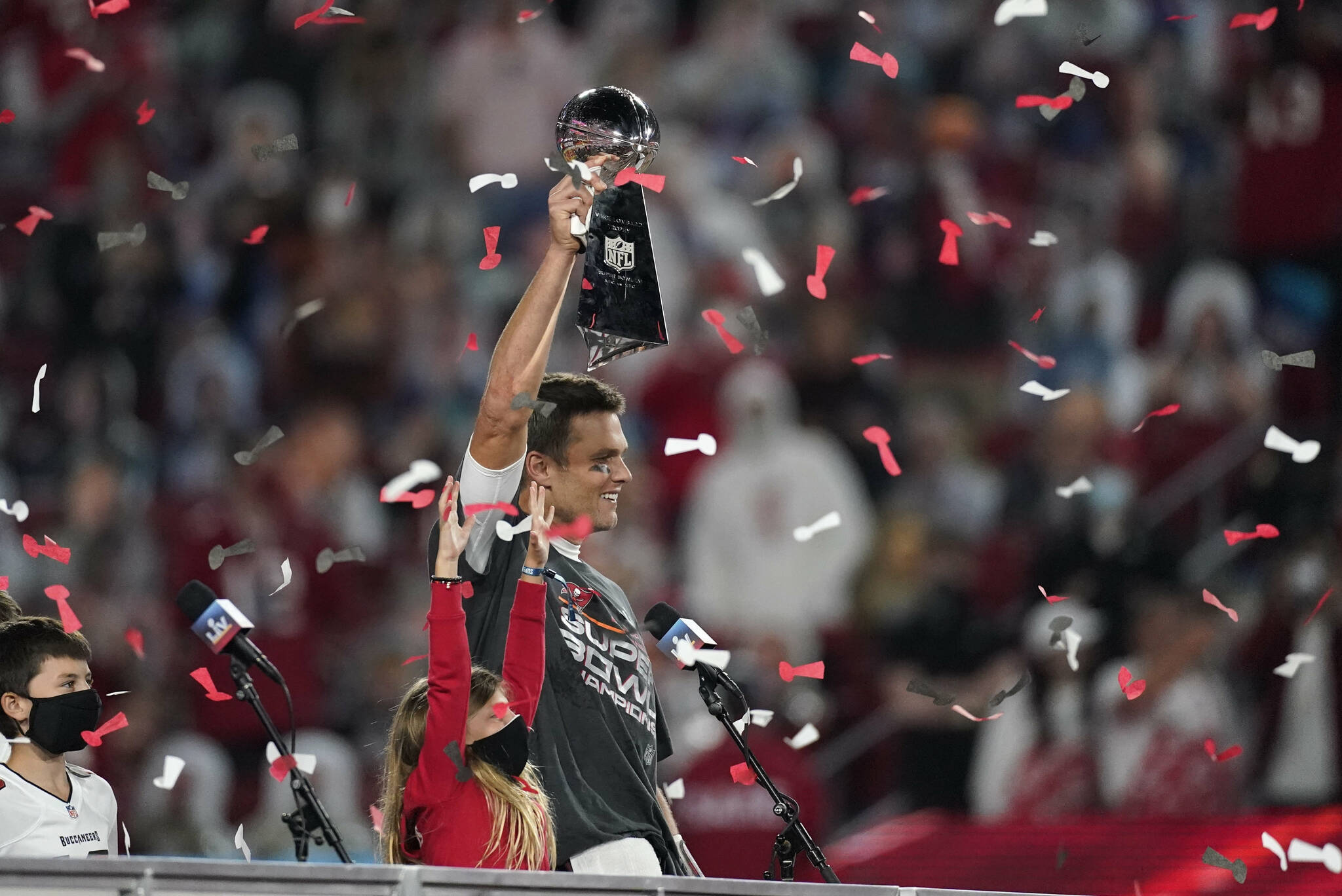 Tampa Bay Buccaneers quarterback Tom Brady holds up the Vince Lombardi trophy after defeating the Kansas City Chiefs in the NFL Super Bowl 55 football game Sunday, Feb. 7, 2021, in Tampa, Fla. The Buccaneers defeated the Chiefs 31-9 to win the Super Bowl. (AP Photo/Ashley Landis)
