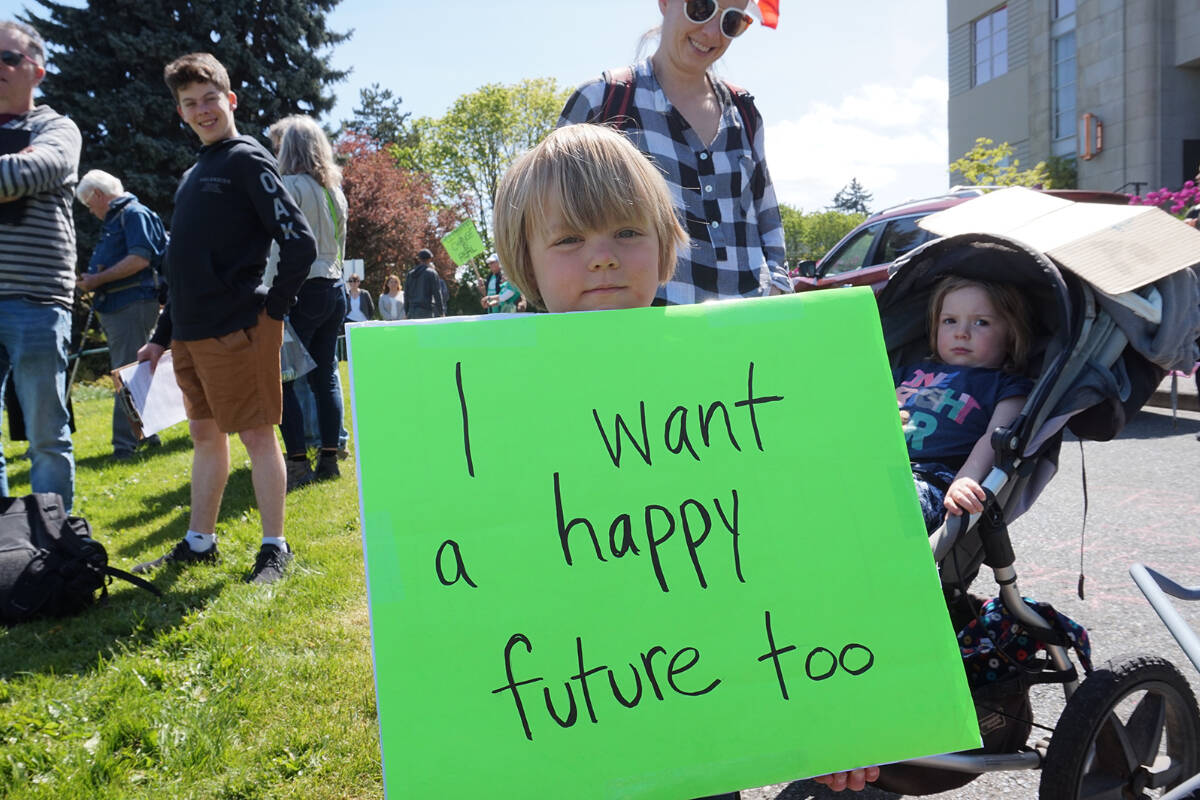FILE: Four-year-old Jonah Arbez holds a protest sign at a Friday’s Strike for Climate on the steps of Nanaimo City Hall in 2019. (Cole Schisler/Black Press)