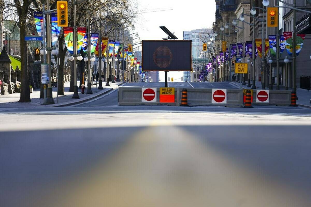 A traffic free Wellington Street is pictured prior to the start of a demonstration, part of a convoy-style protest participants are calling “Rolling Thunder”, in Ottawa, Saturday, April 30, 2022. THE CANADIAN PRESS/Sean Kilpatrick