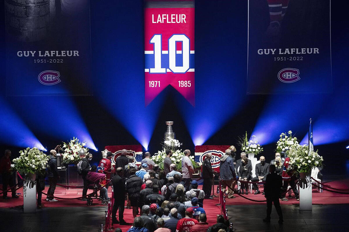 Fans line up to pay their respects during the visitation for Montreal Canadiens legend Guy Lafleur, Sunday, May 1, 2022 at the Bell Centre in Montreal.THE CANADIAN PRESS/Ryan Remiorz
