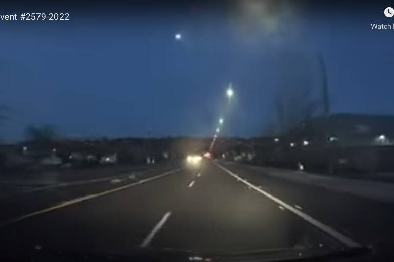 Briefly seen over a road in Kent, Wash., this fireball was seen in multiple places in B.C., including Agassiz, Abbotsford and Peachland. The event was seen on Tuesday, April 26, between 8:45 p.m. and 9:05 p.m. (Screenshot/AMS)